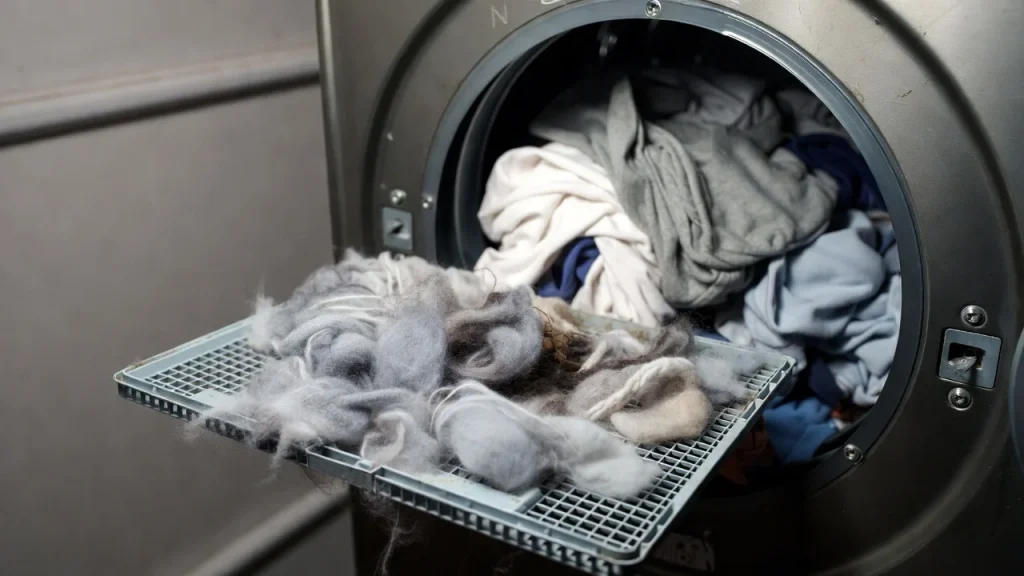 a clogged dryer lint trap and an overfilled dryer drum